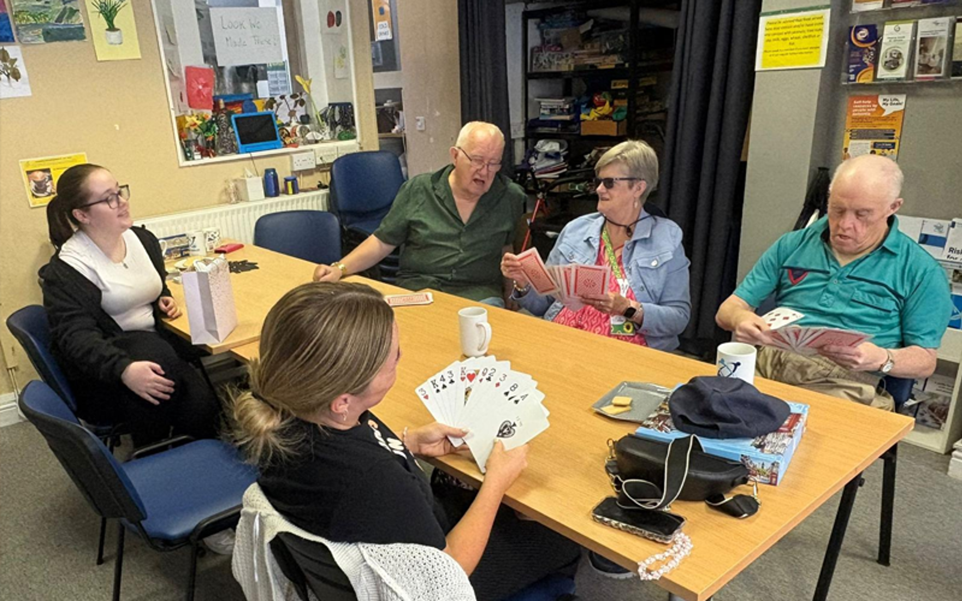 Group of people playing cards