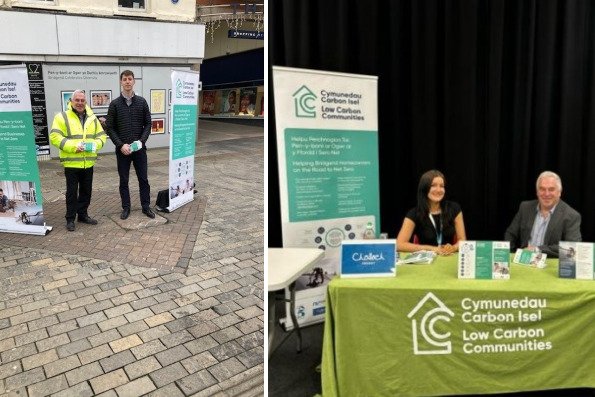 Dau berson wrth ymyl stondin cyngor ynni ac effeithlonrwydd